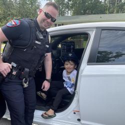 officer wright with child in car