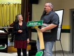 Mayor Fleta Byrd presenting street sign to Randy Jernigan