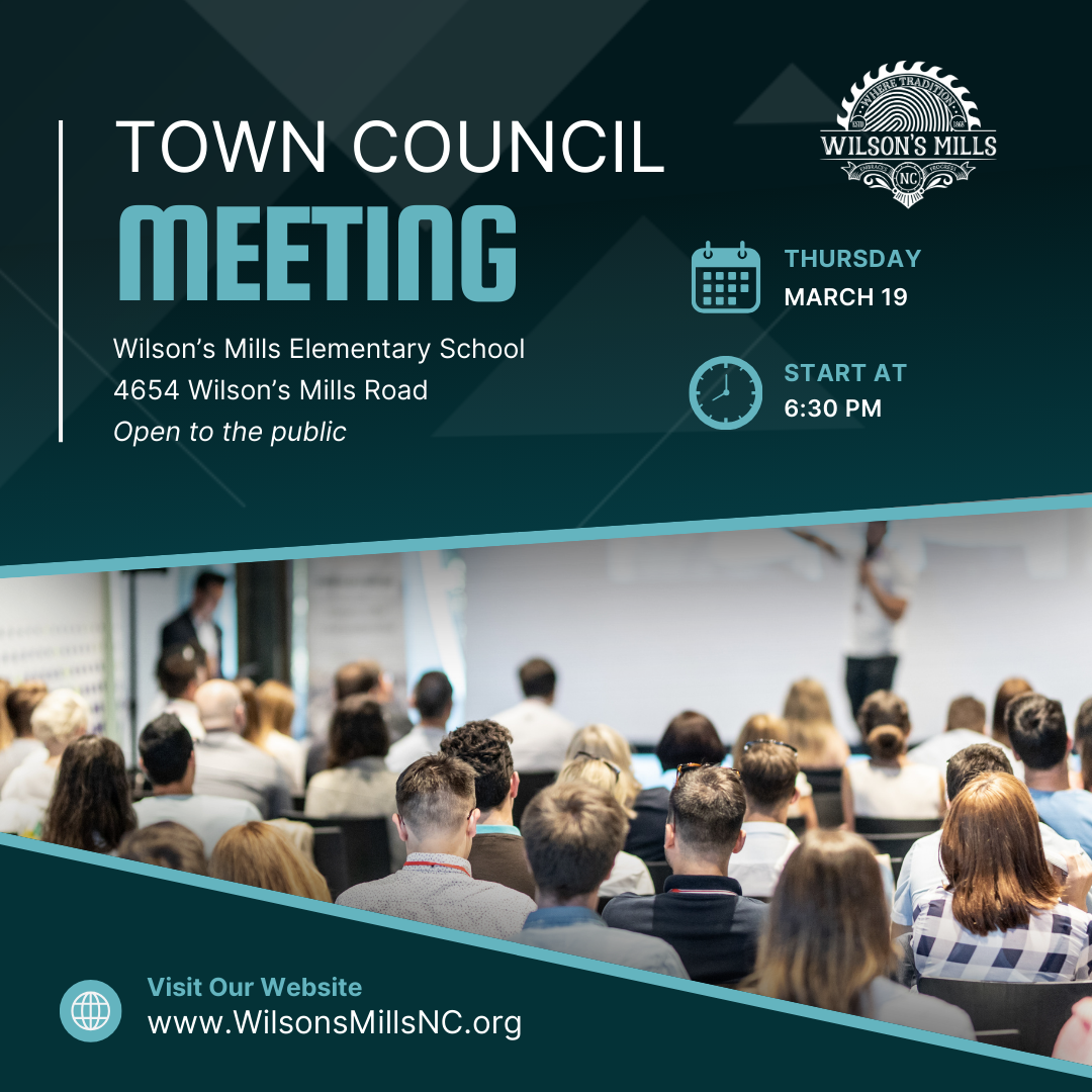 People attending a meeting in a large room or auditorium