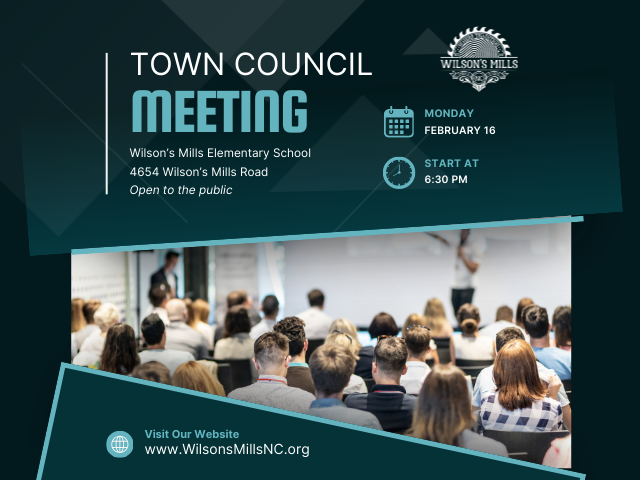 People attending a meeting in a large room or auditorium